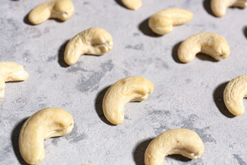Tasty cashew nuts on grunge background