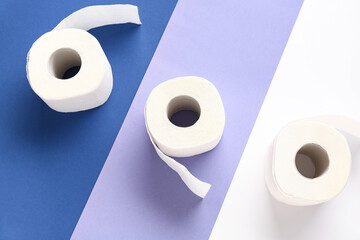 Rolls of toilet paper on colorful background