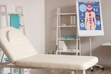 Interior of medical office with couch and shelf units