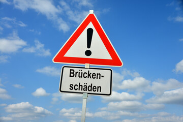 Hamburg, Germany - April 18, 2025: Traffic warning sign saying in German Brückenschäden - Bridge damage