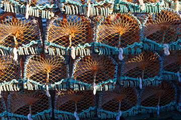 Stacks of crab traps on harbour in Scotland on a cold winters morning. 