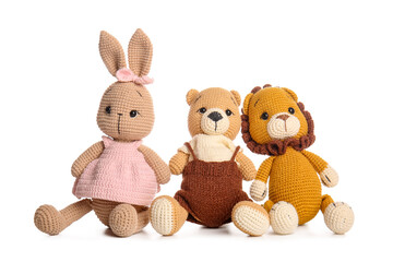 Set of cute knitted toys on white background