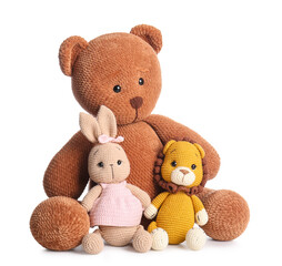 Cute knitted toys on white background