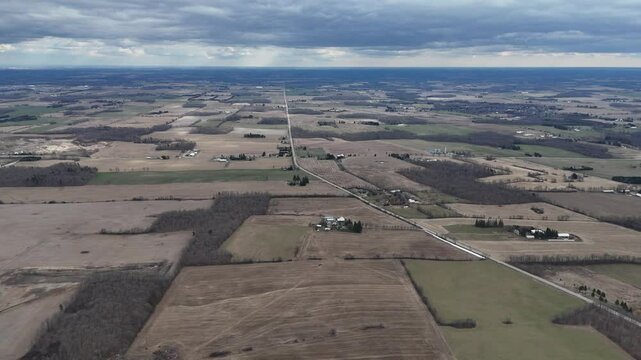 Aerial imagery over Kitchener, Ontario reveals rural homes dotted across expansive farmfields