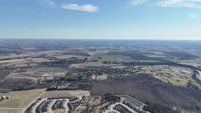 Aerial view over Kitchener, Ontario revealing a blend of farm fields and rural settlements