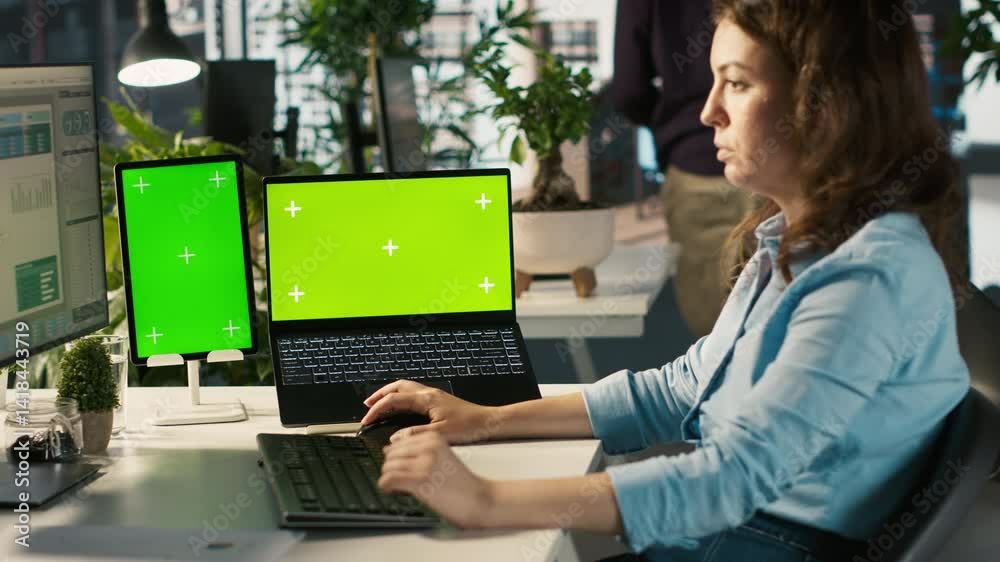 Poster office clerk uses chroma key devices to read data statistics on display after audit. employee at wor