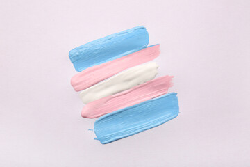 Transgender flag made of paint strokes on white background