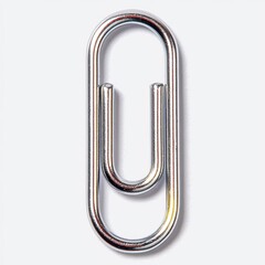 Close up of a Shiny Chrome Paperclip on a Gray Background