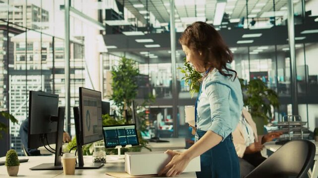 Happy employee starting first day at new job, unpacking belongings, meeting coworkers. Cheerful worker arriving in office, starting work on new company position, being welcomed by team, camera B