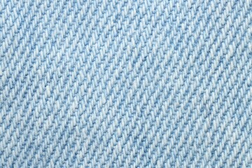 Texture of light blue denim fabric as background, top view