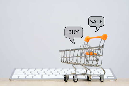 A shopping cart on a keyboard represents online shopping. The speech bubbles showing 'buy' and 'sale' highlight the convenience of digital commerce.