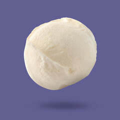 Ice cream scoop in air on pale purple background. Yummy dessert