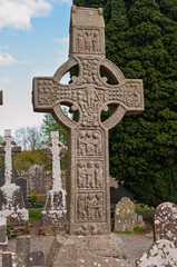 A large stone cross with a cross on top of it