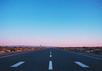 Fototapeta premium Straight road under blue sky