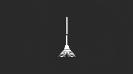 White leaf rake on dark background; cleaning, autumn
