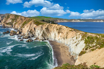 Breathtaking aerial view of Point Reyes, California, showcasing dramatic coastal cliffs surrounded by the Pacific Ocean. A stunning destination for nature lovers, photographers, and outdoor © Volodymyr