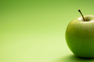 Green and red apples on colorful backgrounds – healthy eating and fruit concept