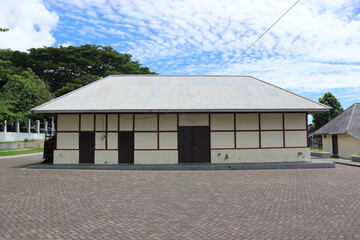 An old warehouse building with an ancient architectural style. Suitable for use as a background for ancient or horror themes  © Hary TS