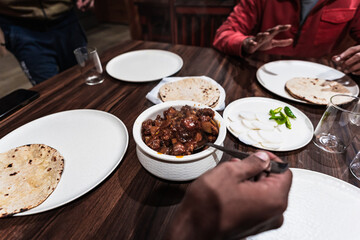 Close-up of spicy Indian-style Chicken Chilly served in a ceramic bowl — a popular Indo-Chinese dish made with crispy fried chicken, onions, and tangy sauces.