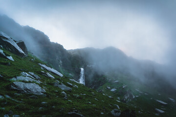 Pristine waterfall during Thamsar pass trail in monsoon season in the Himalayas mountain during a trek in Himachal Pradesh, india	