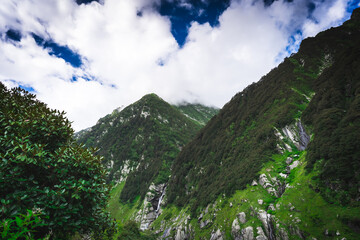 Beautiful landscape shot of a gorgeous Himalayan mountain valley with dense forests during monsoon...
