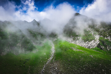 Beautiful landscape shot of a gorgeous Himalayan mountain valley with dense forests during monsoon...