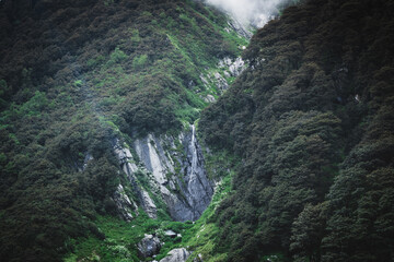 Rustic shot of beautiful mountains with waterfall in Barot Valley, himachal Pradesh.


