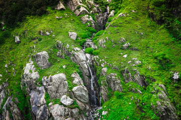 Beautiful landscape shot of a gorgeous barot mountain valley with dense forests during monsoon...