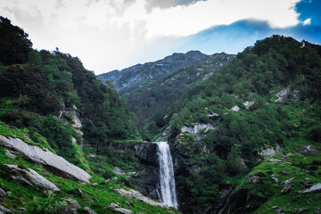 Pristine waterfall in monsoon season in the Himalayas mountain during a trek in Himachal Pradesh, india	