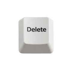 A single delete key from a computer keyboard close up photograph isolated on white background
