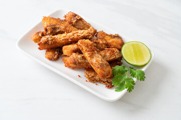 Fried Snapper Belly on white plate