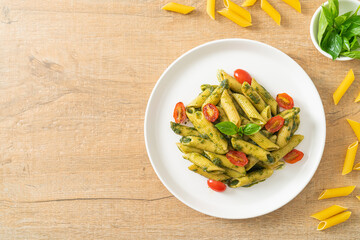 penne pasta with pesto sauce and tomatoes