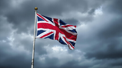 british flag waving in the wind of the storm sky