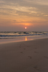 Sunset serenity over ocean waves beachfront scenic photography tranquil environment horizon view nature's beauty