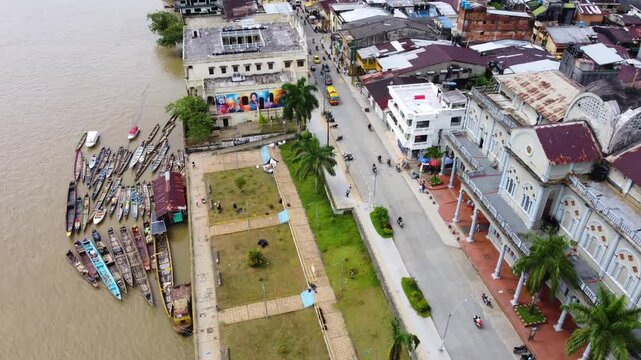 Aerial Majesty of Quibd&oacute;: River, Faith, and Rainforest. Drone views of Quibd&oacute;, Choco, Colombia, featuring the Atrato River, boats, rainforest, and the iconic cathedral. A vibrant mix of nature.