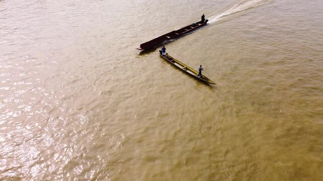 Aerial Majesty of Quibd&oacute;: River, Faith, and Rainforest. Drone views of Quibd&oacute;, Choco, Colombia, featuring the Atrato River, boats, rainforest, and the iconic cathedral. A vibrant mix of nature.