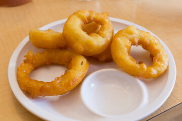 Delicious onion rings local diner food photography casual setting close-up shot comfort food delight