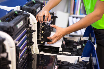 Technician Holding ink printer toner drum for replace new or fix repair paper printing scanning fax...