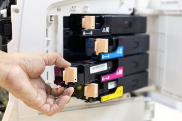 Technician Holding ink printer toner low for replace new or fix repair problem paper or print...