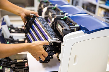 Technician Holding ink printer toner drum for replace new or fix repair paper printing scanning fax...