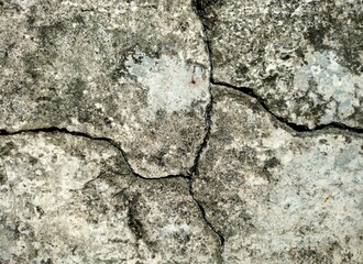 texture of the old wall, There is a wall with a fairly long crack that looks old. The crack stretches from the top corner to the middle of the wall, with a dark color along the gap.