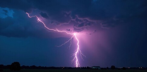 Jagged lightning bolt illuminates dark stormy sky, night, lightning photography