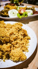 Crispy fried chicken served on a white plate, a delicious meal experience
