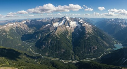 Fototapeta premium Aerial View of Snow Capped Mountain Range and Valley