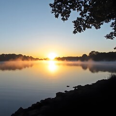 Obraz premium Misty Sunrise over Calm Lake, Golden Hour Landscape