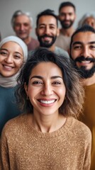 Obraz premium A diverse group of smiling individuals gathered together, radiating warmth and joy in a close-up portrait.
