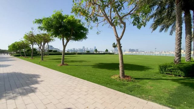 A beautifully landscaped section of Sheikha Fatima Park, showcasing vibrant greenery within Abu Dhabi&rsquo;s Al Khalidiyah district.