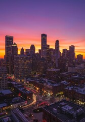 City Skyline at Sunset with Vibrant Orange and Purple Sky
