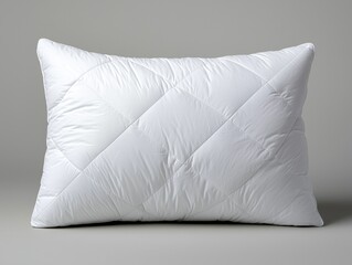 White Quilted Pillow for Comfort, Sleep, and Relaxation on Gray Background