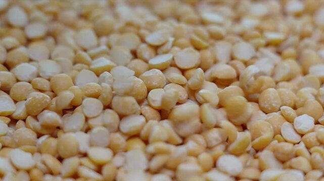 Yellow toor dal , toor dhal or dal slow motion footage. Indian food